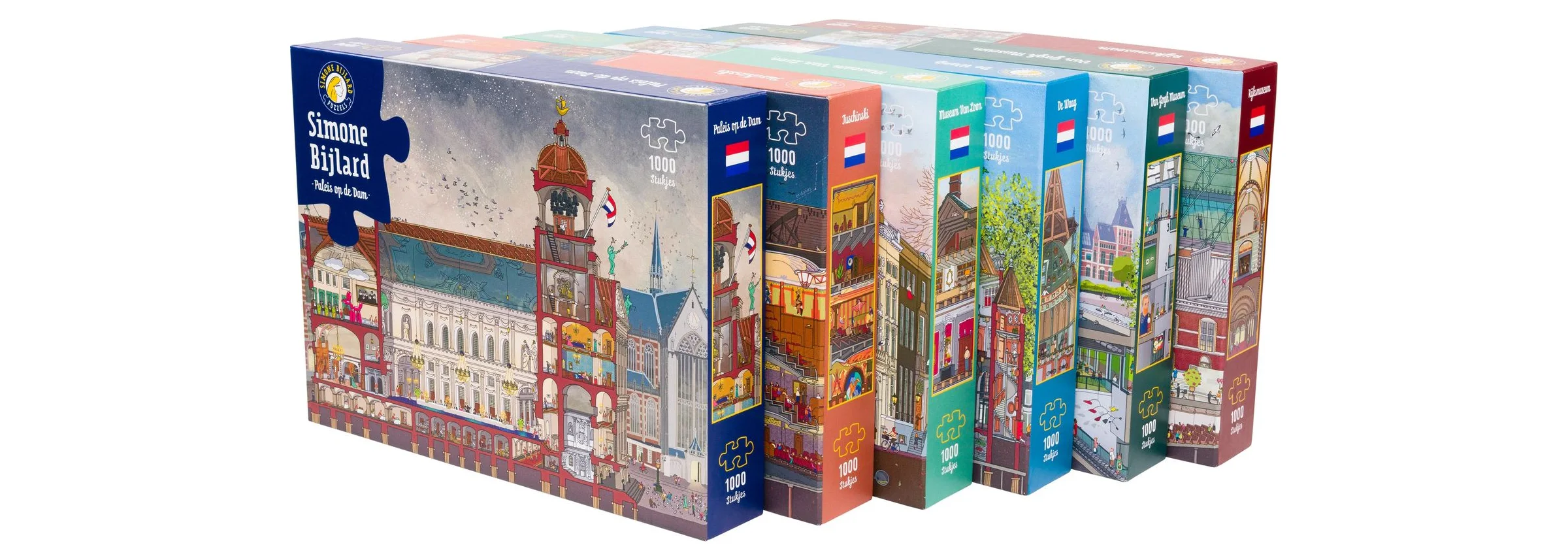 De zes legpuzzels van Simone Bijlard in hun dozen naast elkaar